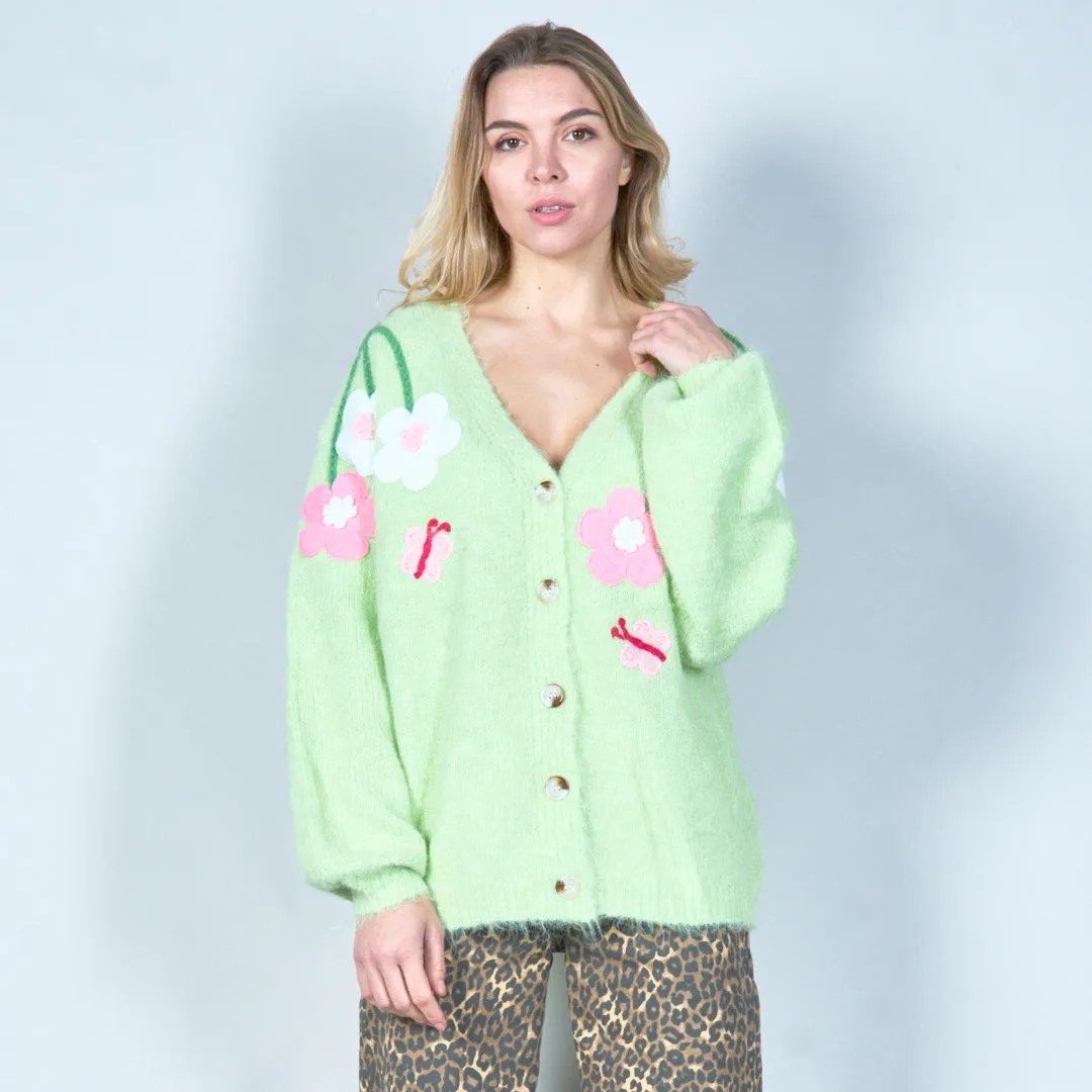 Pastel green cardigan with floral appliqués and butterfly embroidery