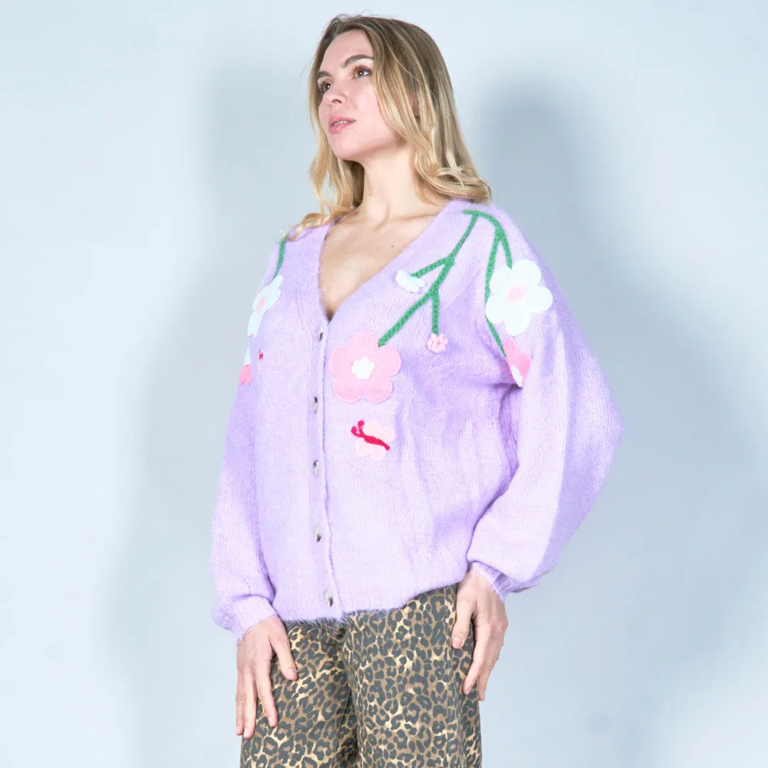 Pastel green cardigan with floral appliqués and butterfly embroidery