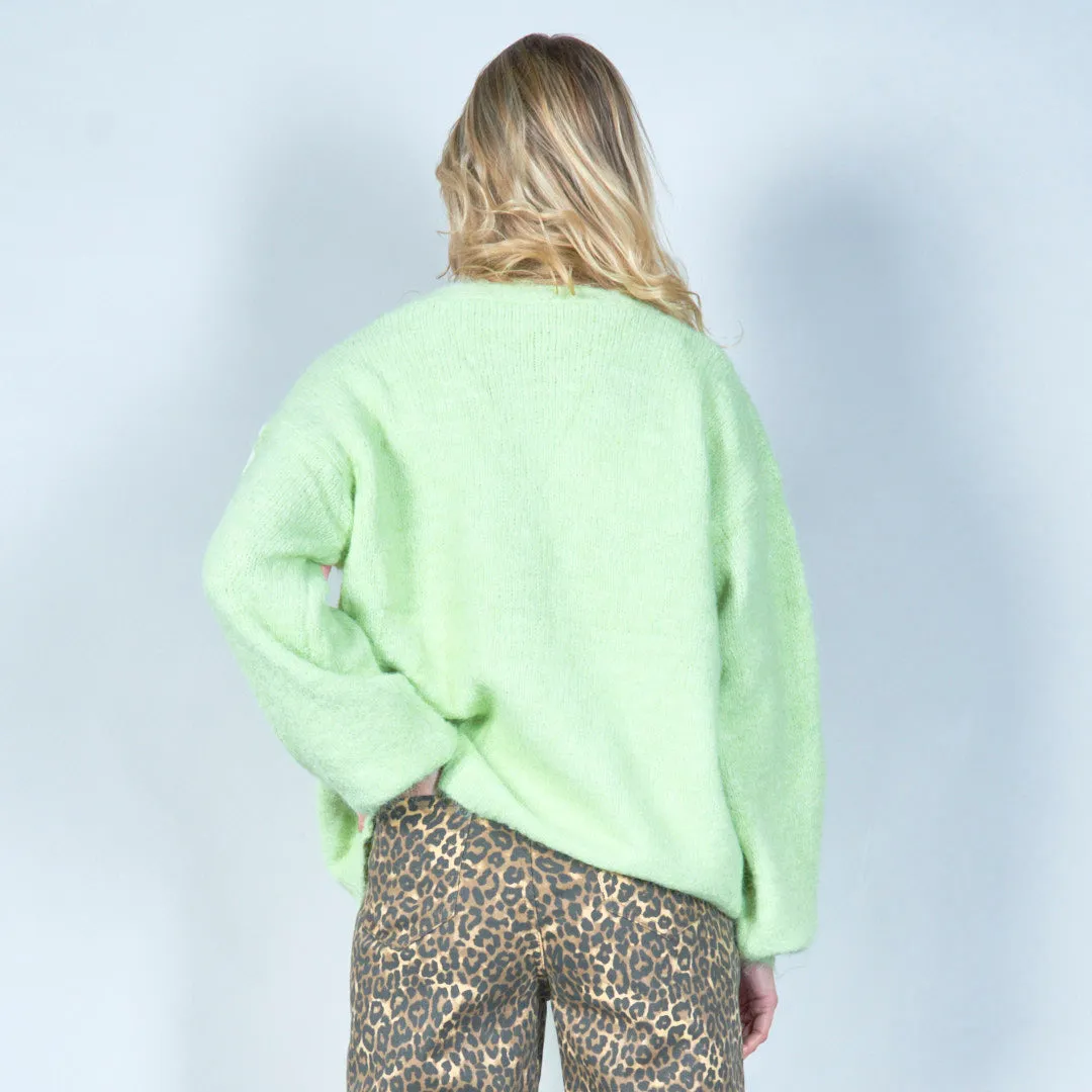 Pastel green cardigan with floral appliqués and butterfly embroidery