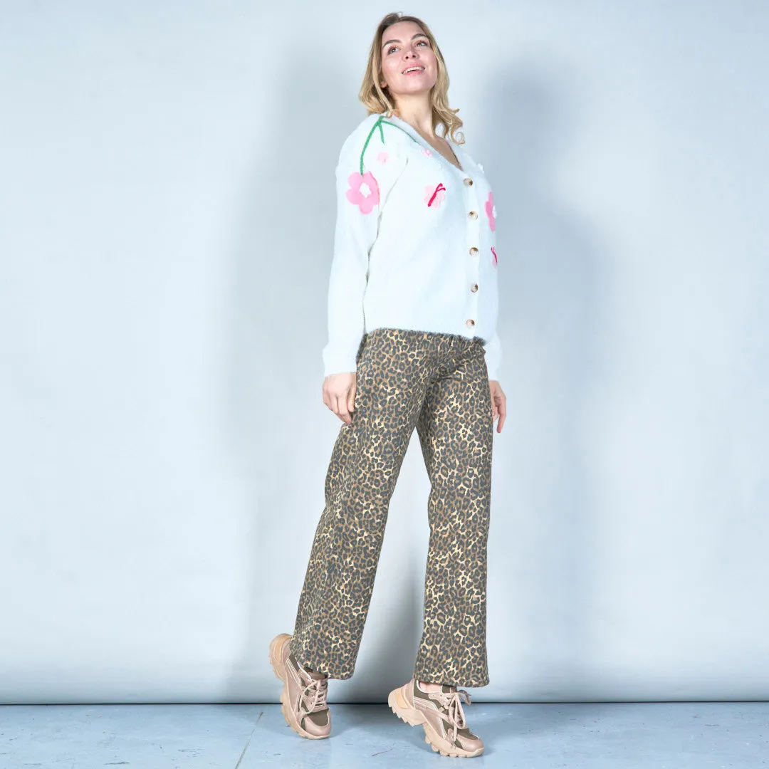 Pastel green cardigan with floral appliqués and butterfly embroidery