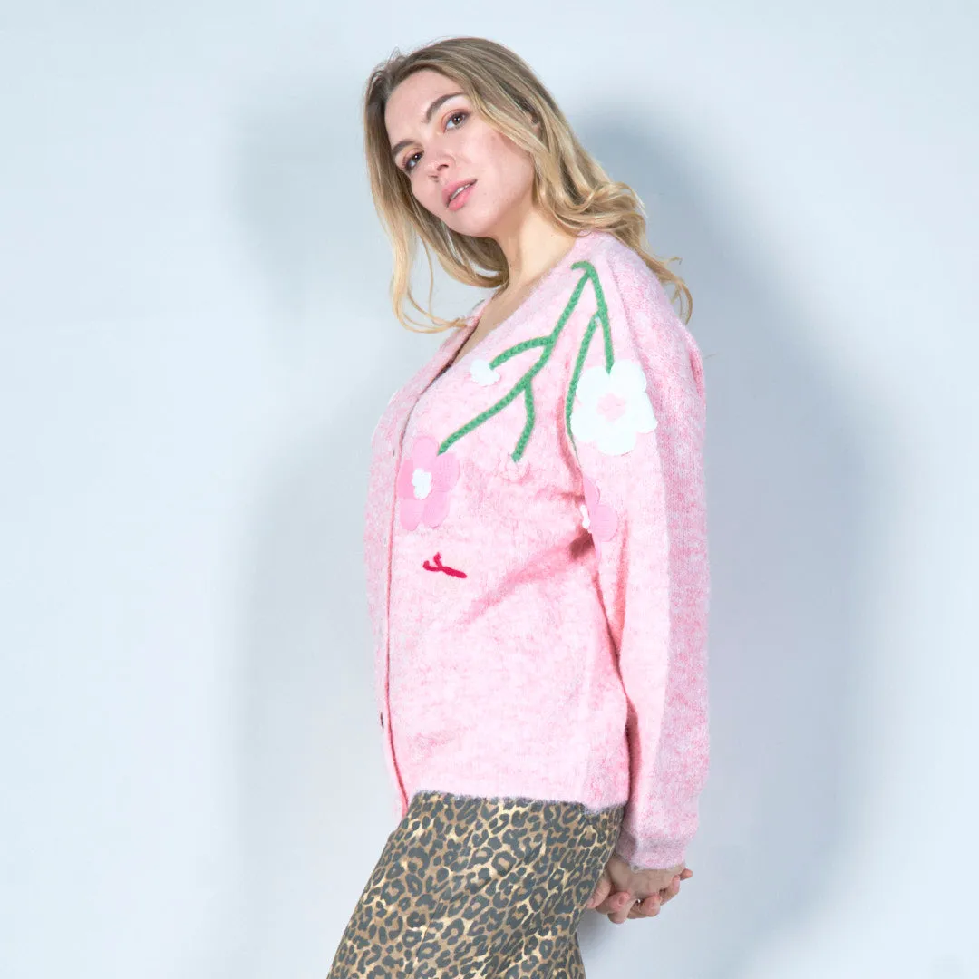 Pastel green cardigan with floral appliqués and butterfly embroidery