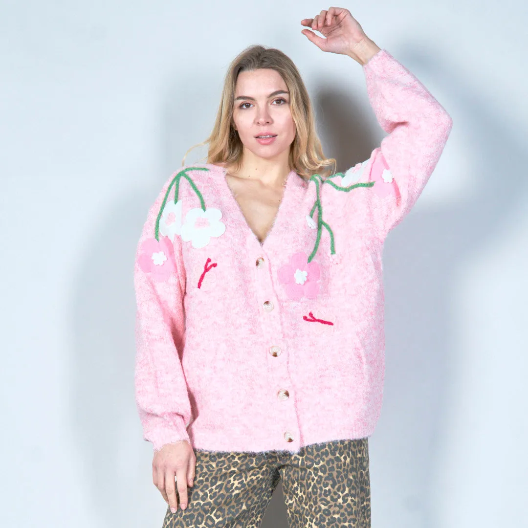 Pastel green cardigan with floral appliqués and butterfly embroidery