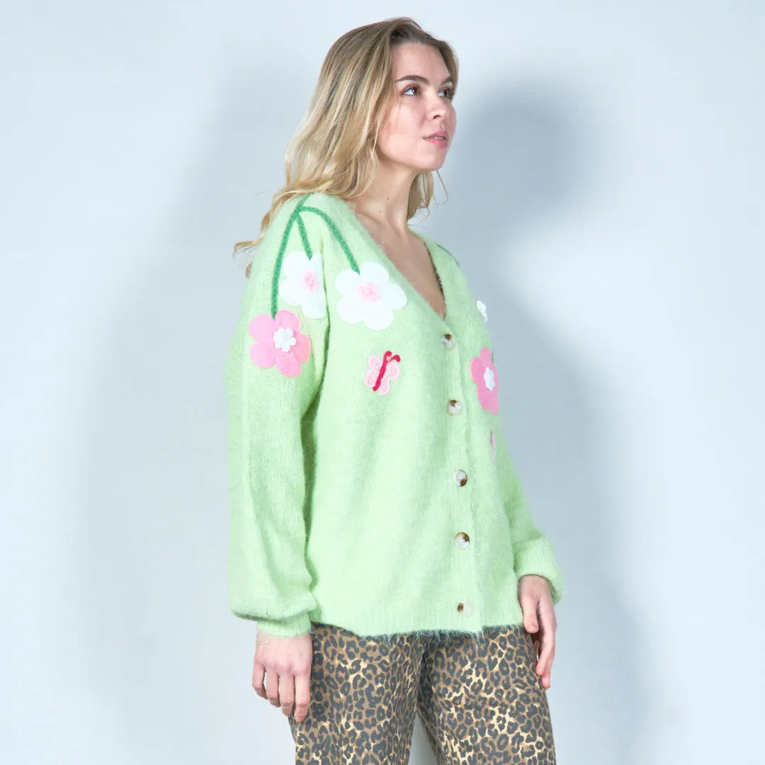Pastel green cardigan with floral appliqués and butterfly embroidery