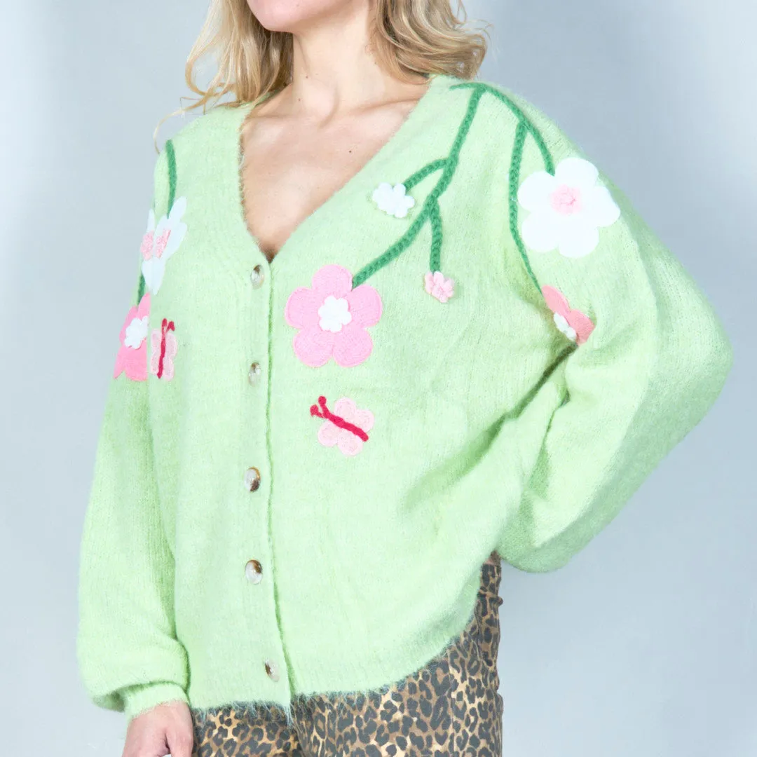 Pastel green cardigan with floral appliqués and butterfly embroidery