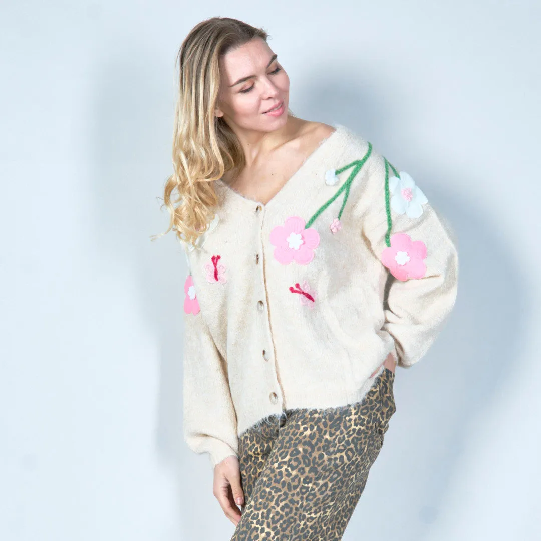 Pastel green cardigan with floral appliqués and butterfly embroidery