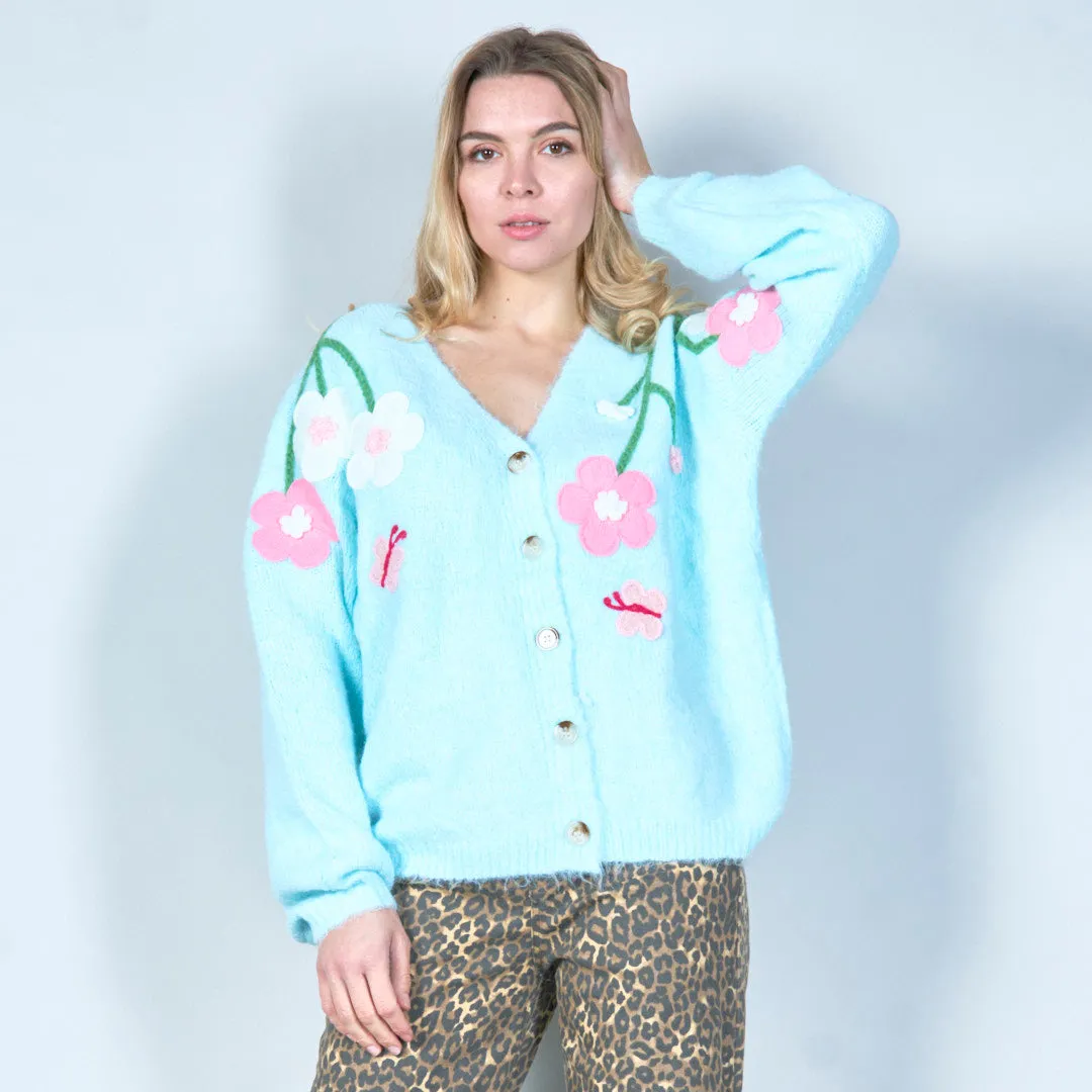 Pastel green cardigan with floral appliqués and butterfly embroidery