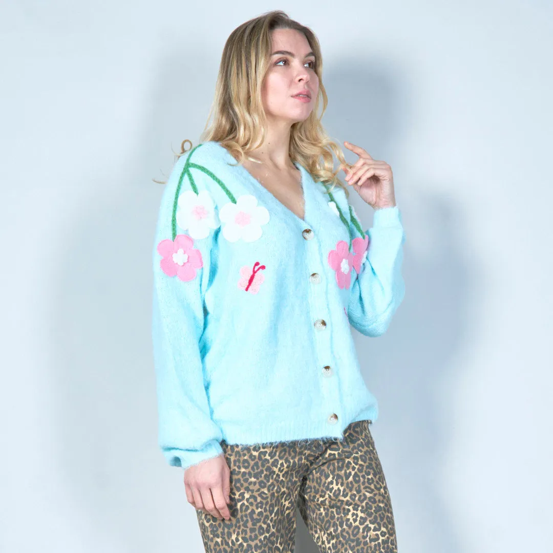 Pastel green cardigan with floral appliqués and butterfly embroidery